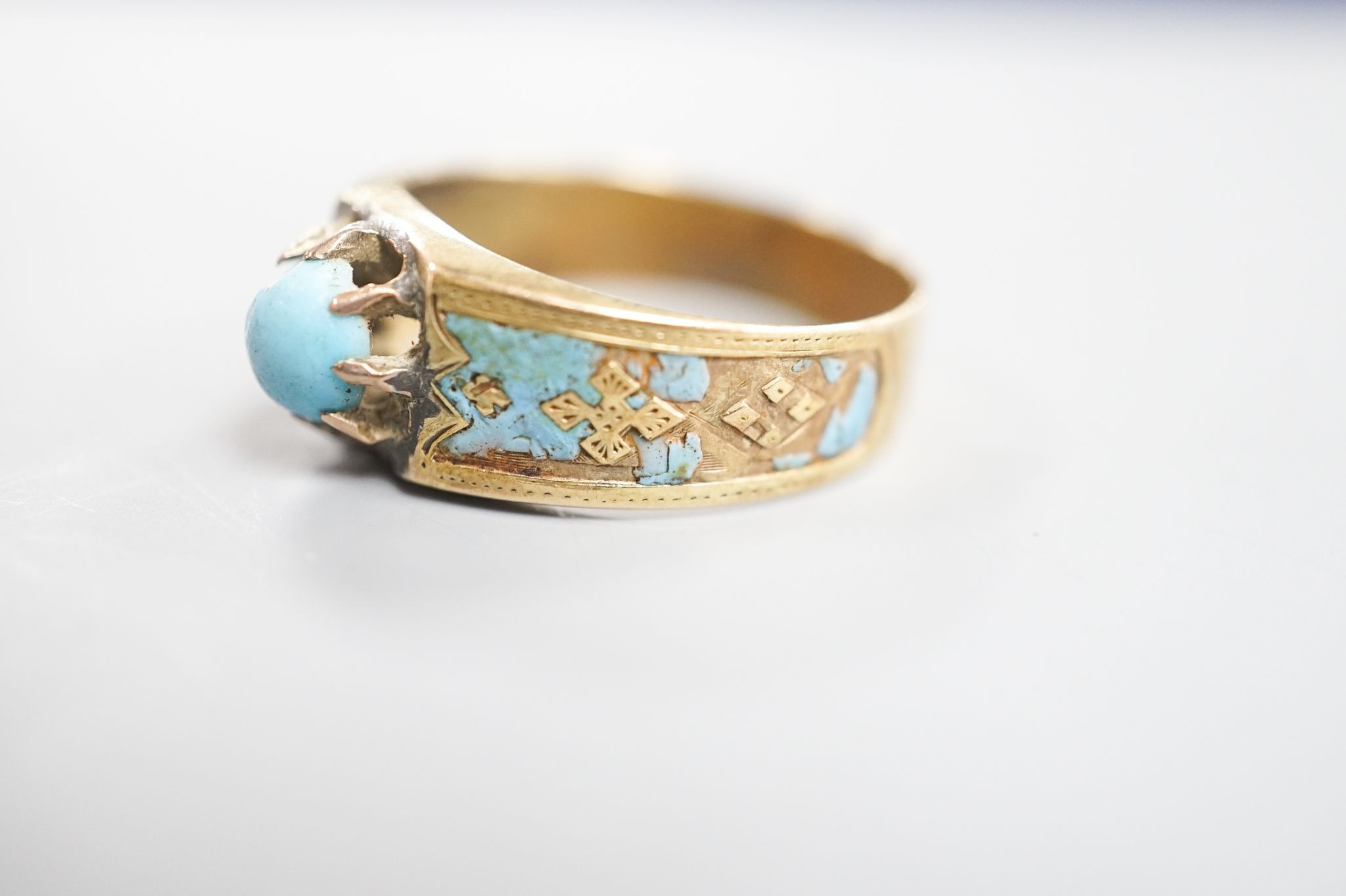 An antique yellow metal, turquoise and enamel set ring, size U/V, and a Victorian yellow metal and turquoise pendant, gross weight 6.3 grams.